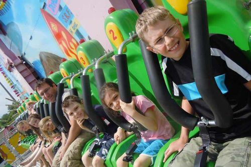Jamboree goers buckle up at the new midway ride “Surf's Up” at the 63rd annual Verona Lions Lions Jamboree on June 6